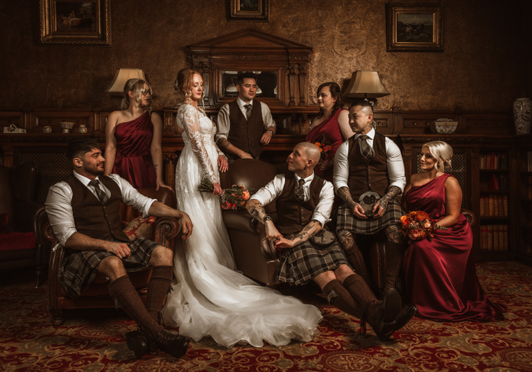 Regal-style image of bride, groom and their bridesmaids and groomsmen at Norwood Hall Hotel